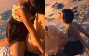 Casal safado transando na praia com tesão e cara de pau